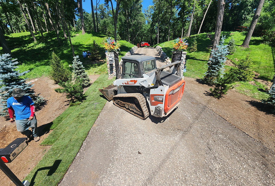A new rock retaining wall with fresh mulch and plants in Crystal Lake, Illinois