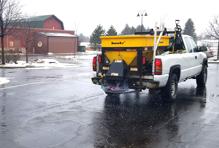Ice melt applied along a commercial walkway