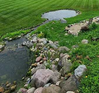 A beautiful pond with functional, decorative stones.