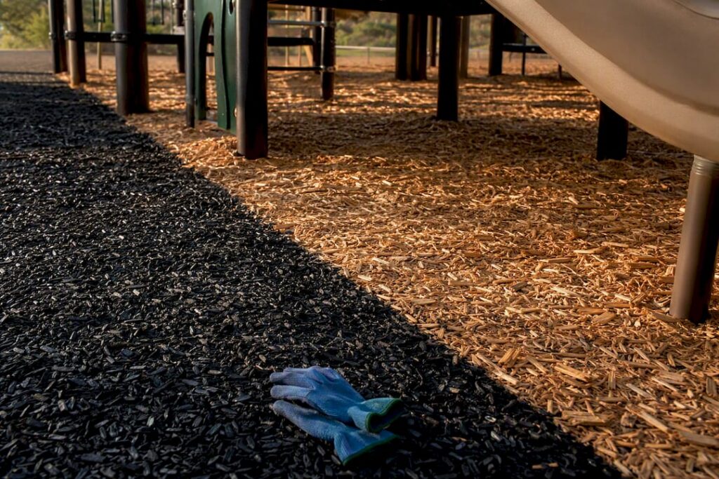 Rubber and wood mulch beneath playground equipment