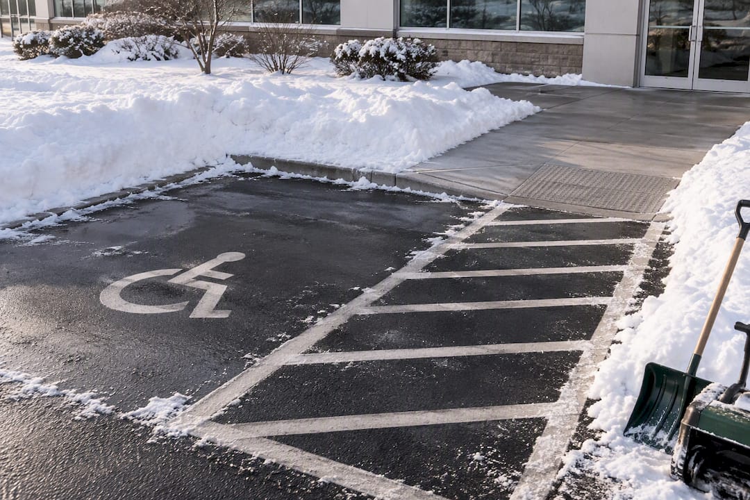 Snow-free accessible parking aisle and curb ramp